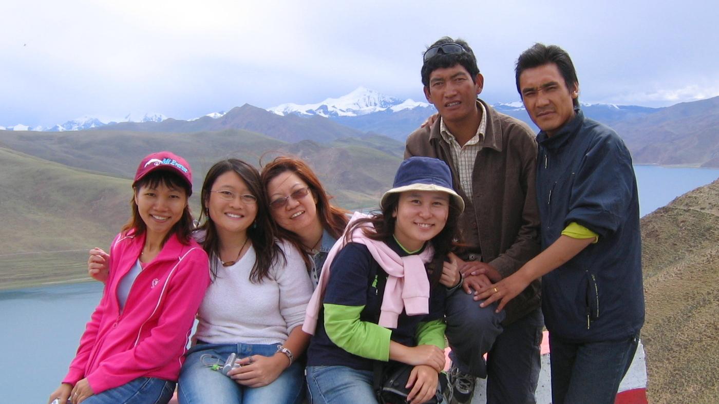 Private Tour vs Group Tour Tibet Small group of travelers with a guide in Tibet